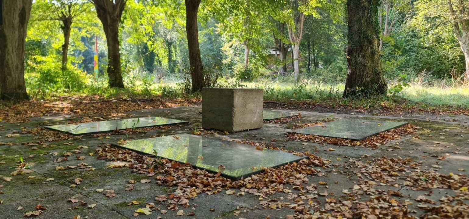 Freya's Grove (Eternal Return) — reclaimed concrete blocks and sheets of glass laid among linden trees in a wooded sculpture park.